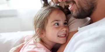 Father and daughter snuggling