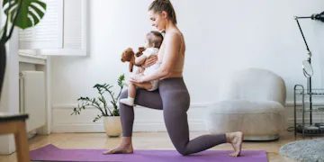 New mom engaging in postpartum exercise with baby during a home workout, showcasing effective postpartum workouts for recovery and fitness.