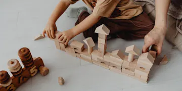 Child exercising fine motor skills with STEAM activity.