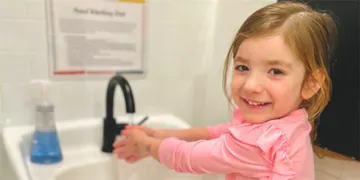 Happy child learning personal hygiene for kids