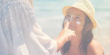 This little girl is enjoying her beach day with the help of these summer safety tips.