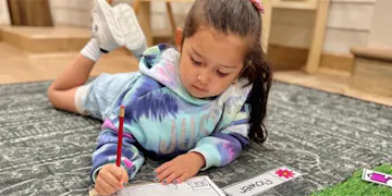 This little girl is capturing memories with journal ideas!