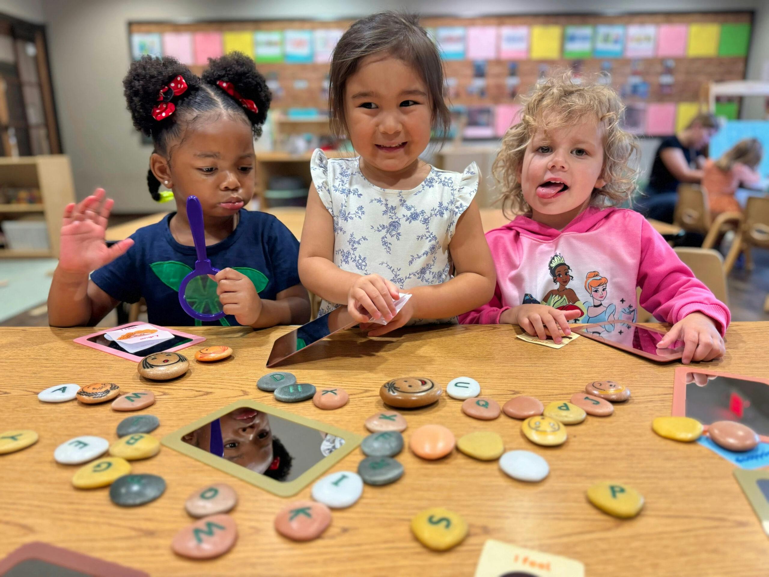 Pictured are three Little Sunshine's Playhouse students engaged in a Reggio Emilia activity.