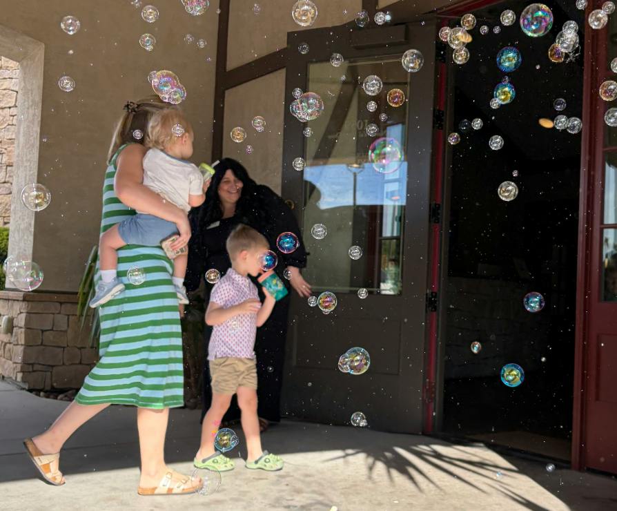 This image depicts one of our Little Sunshine's Daycare families being welcomed into our beautiful school!